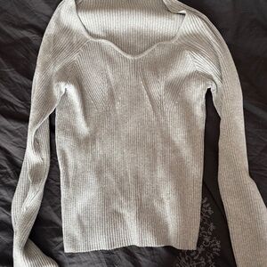 Gray sweater from one of the automatic box companies
